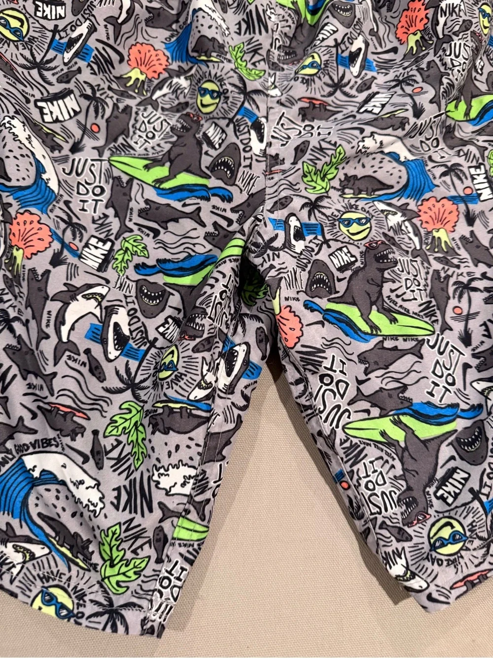Nike Kids Gray Swim Trunks with Bright Graphic Print